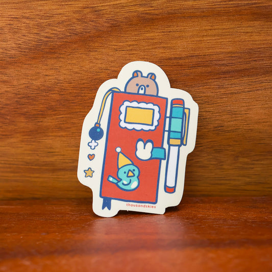 Thousand Skies Vinyl Sticker (Holographic) Weekly Journal